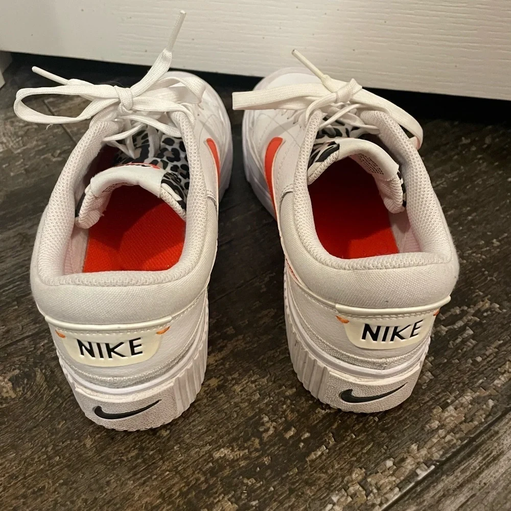 Women’s White and Orange Leopard Nikes sz 7.5 EUC
